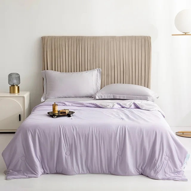 Cooling Blankets Smooth Air Condition Comforter in various colors, designed for summertime comfort, displayed on a bed in a modern bedroom setting.